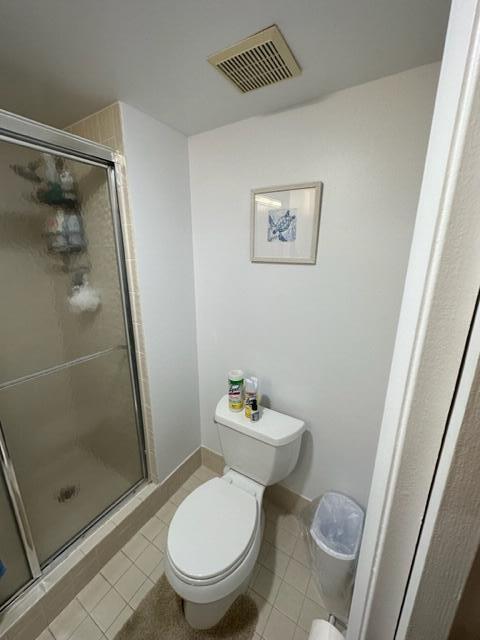 6500 Northwest 2nd Avenue, Unit 512 Boca Raton, FL 33487 - Photo 20 of 41 a white toilet sitting next to a bathroom sink