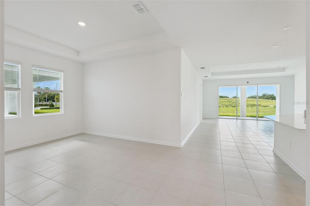 1672 Rider Rain Lane Apopka, FL 32703 - Photo 5 of 35 an empty room with windows
