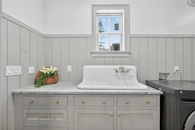 a view of a kitchen with a sink and cabinets