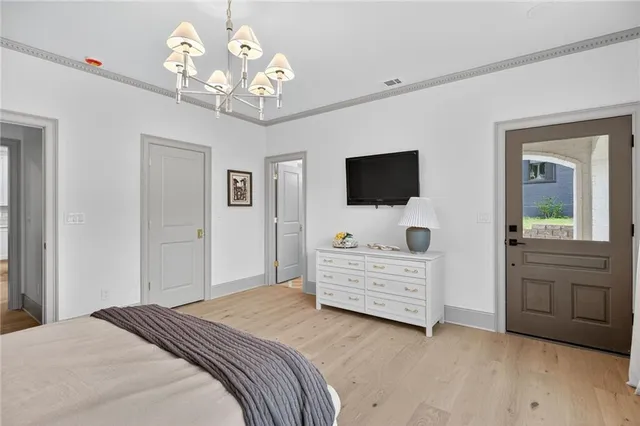 a bathroom with a double vanity sink mirror and toilet
