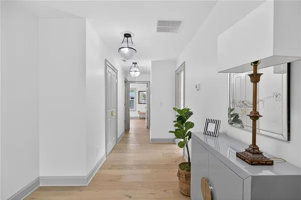 a bathroom with a double vanity sink toilet mirror and shower