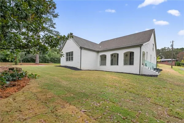 an aerial view of a house with outdoor space