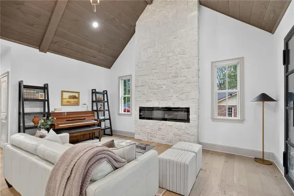 a bedroom with furniture and a fireplace