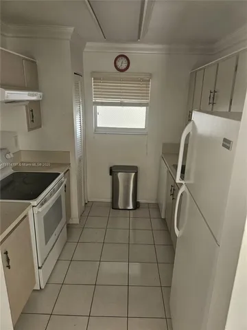 a view of a livingroom with furniture and a dining table chair