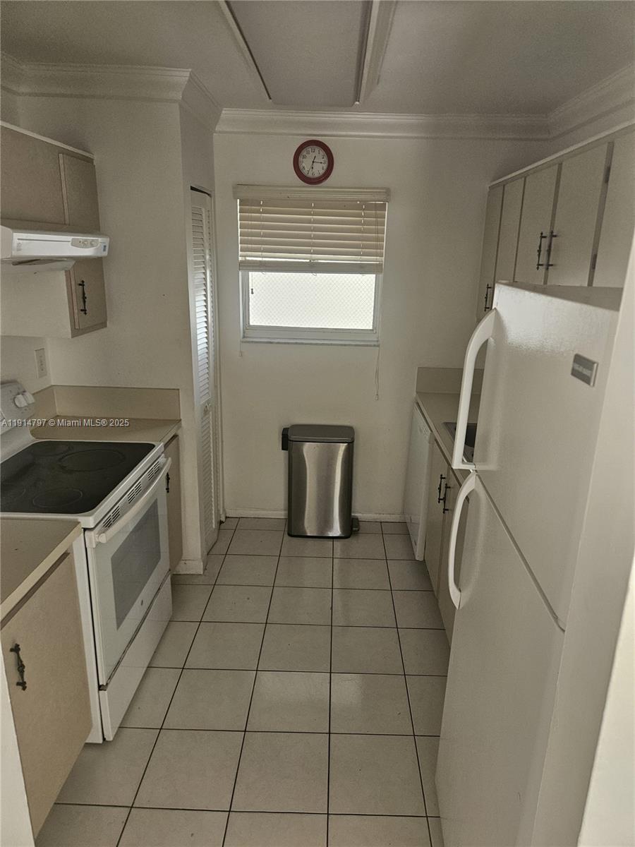 201 178th Drive, Unit 302 Sunny Isles Beach, FL 33160 - Photo 17 of 19 a utility room with a washer and dryer