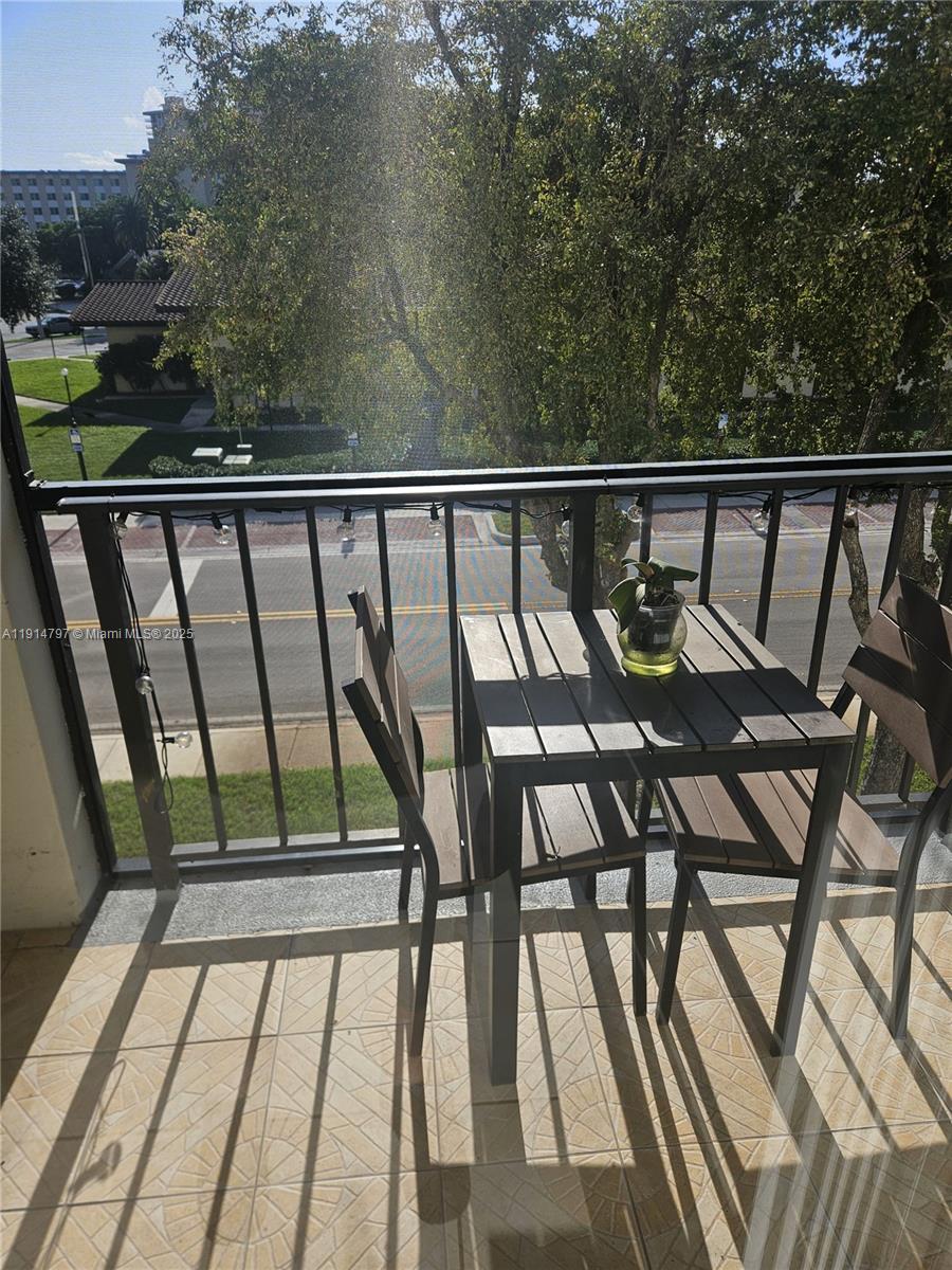 201 178th Drive, Unit 302 Sunny Isles Beach, FL 33160 - Photo 4 of 19 a view of balcony with furniture