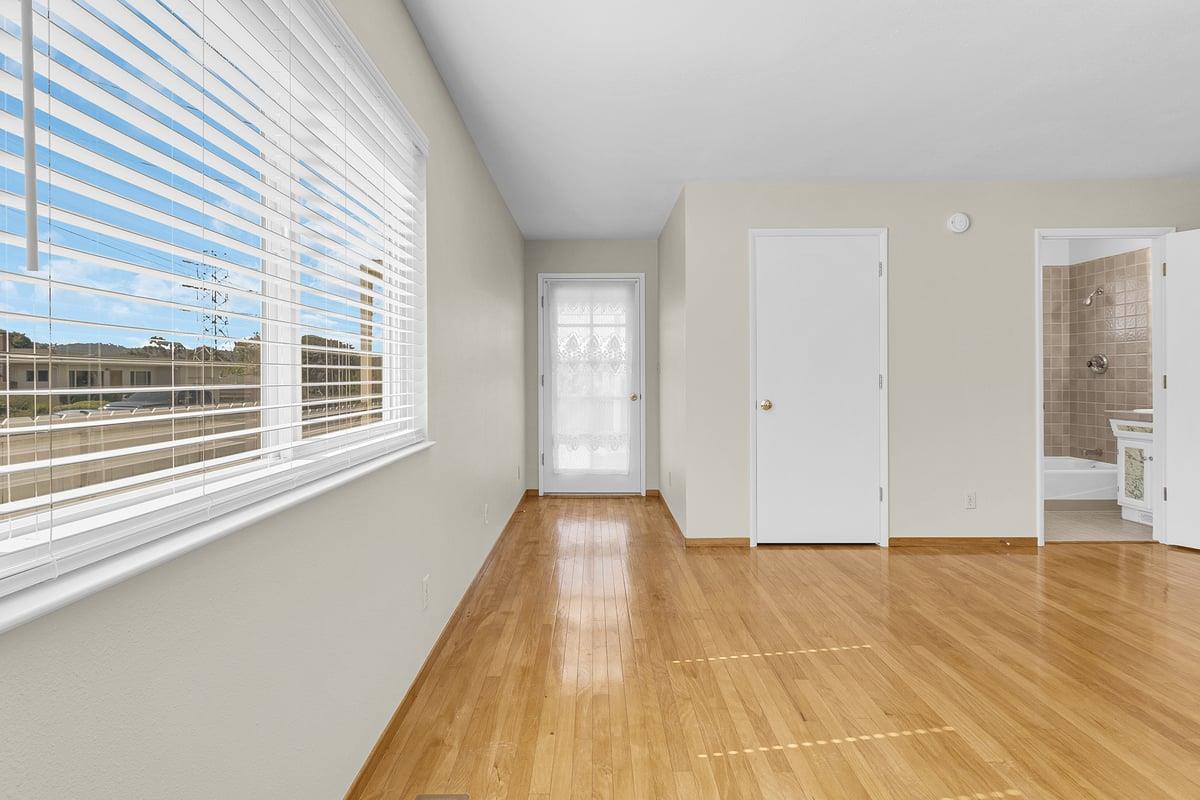 1021 Wheeler Street Seaside, CA 93955 - Photo 11 of 28 a view of a room with wooden floor and windows