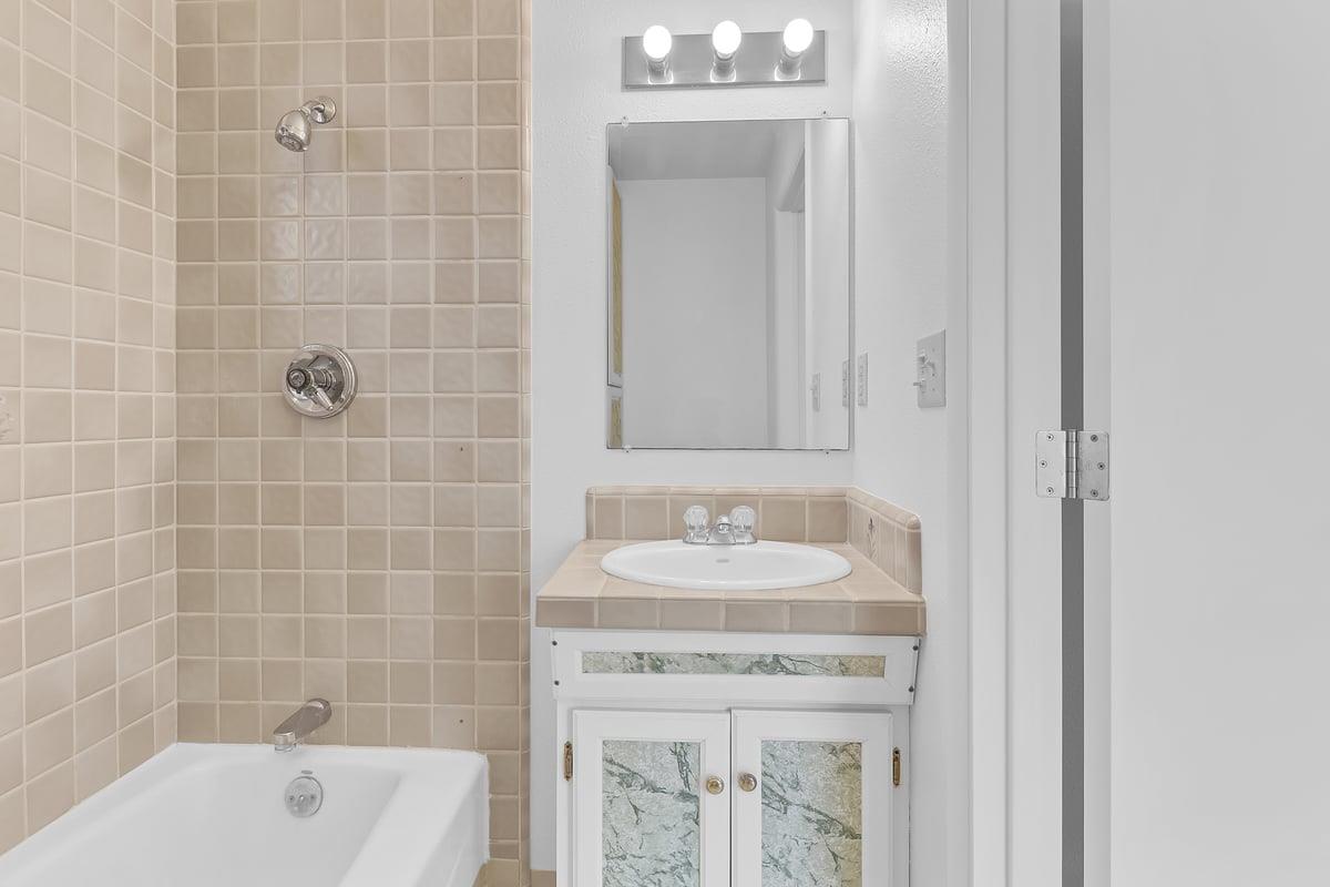 1021 Wheeler Street Seaside, CA 93955 - Photo 14 of 28 a bathroom with a sink and a mirror