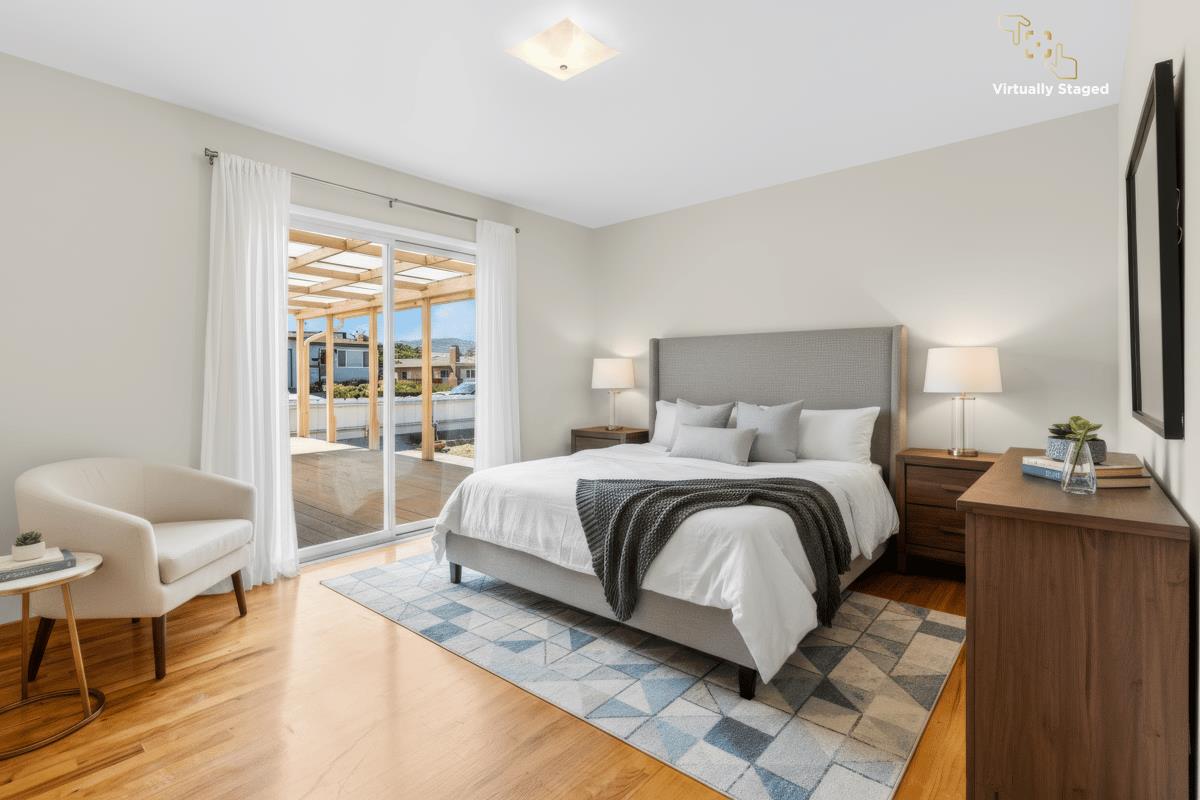 1021 Wheeler Street Seaside, CA 93955 - Photo 16 of 28 a bedroom with a bed and wooden floor