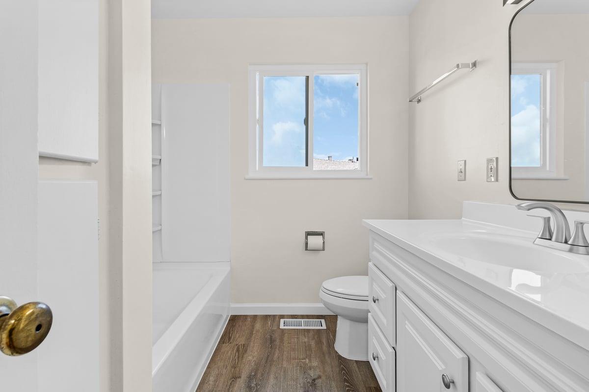 1021 Wheeler Street Seaside, CA 93955 - Photo 18 of 28 a bathroom with a sink a toilet and a mirror