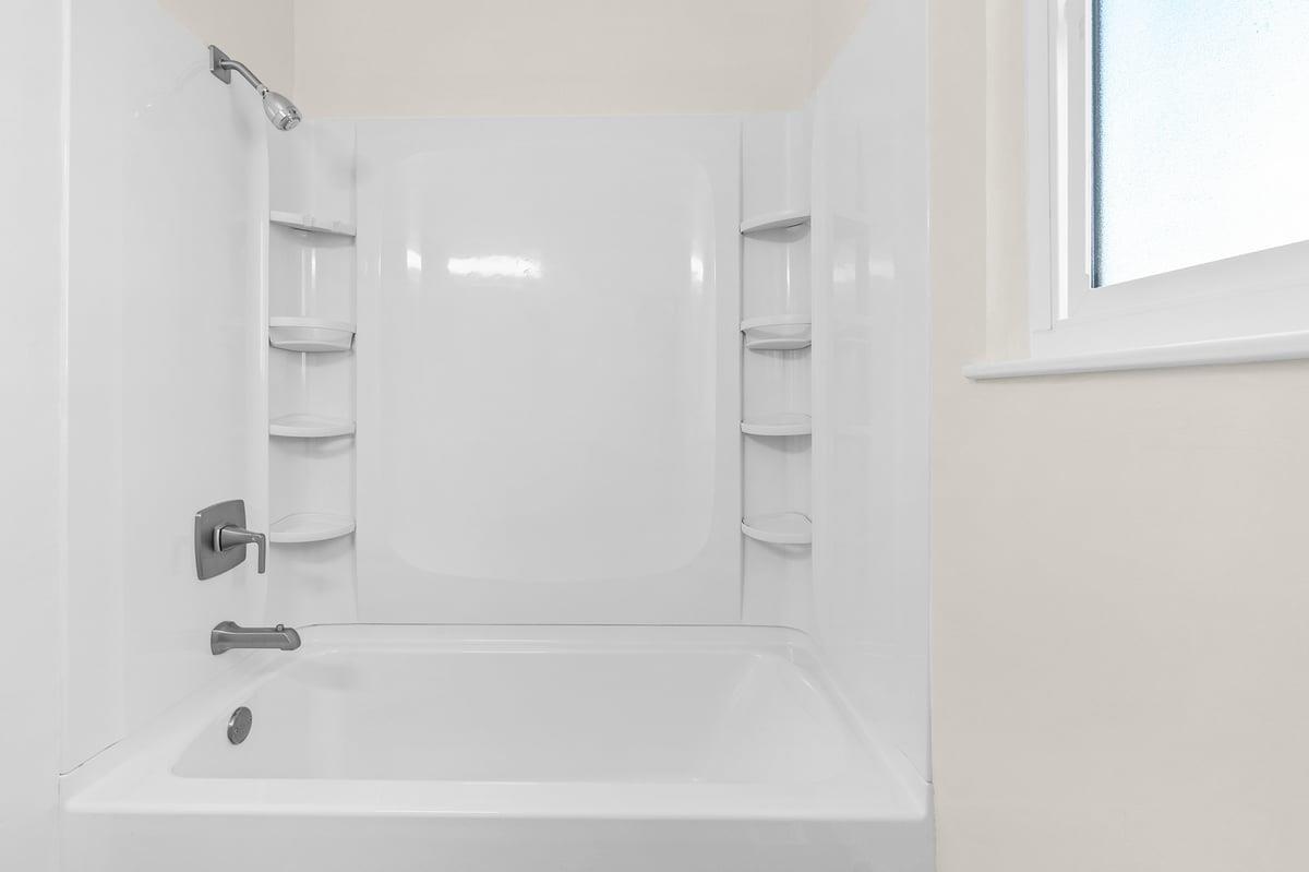 1021 Wheeler Street Seaside, CA 93955 - Photo 19 of 28 a bathroom with a bathtub and shower