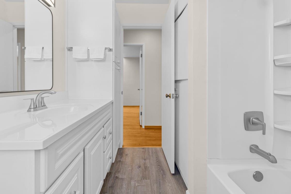 1021 Wheeler Street Seaside, CA 93955 - Photo 20 of 28 a bathroom with a tub sink and mirror