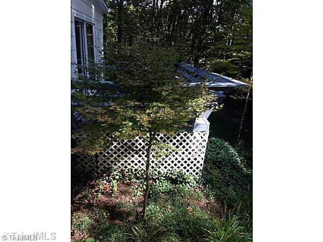 1804 Red Forest Road Greensboro, NC 27410 - Photo 8 of 10 Exterior Back. Private yard is full of Japanese Maple trees