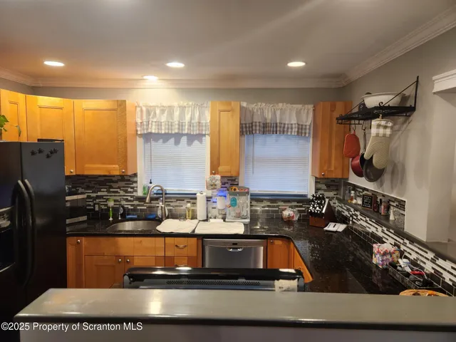 a view of a kitchen with a sink and a stove