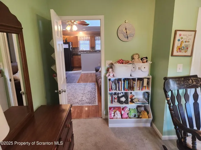 a view of a storage and utility room with washer and dryer