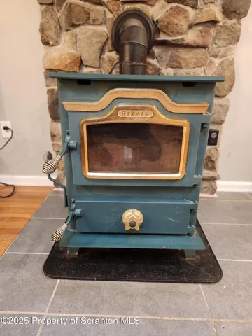 a view of a kitchen with furniture and wooden floor