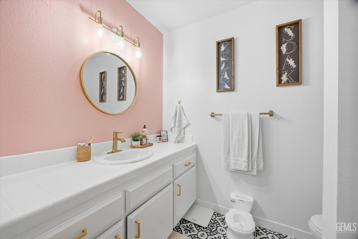 Undisclosed Address Tehachapi, CA 93561 - Photo 25 of 46 a bathroom with a toilet a sink and a mirror