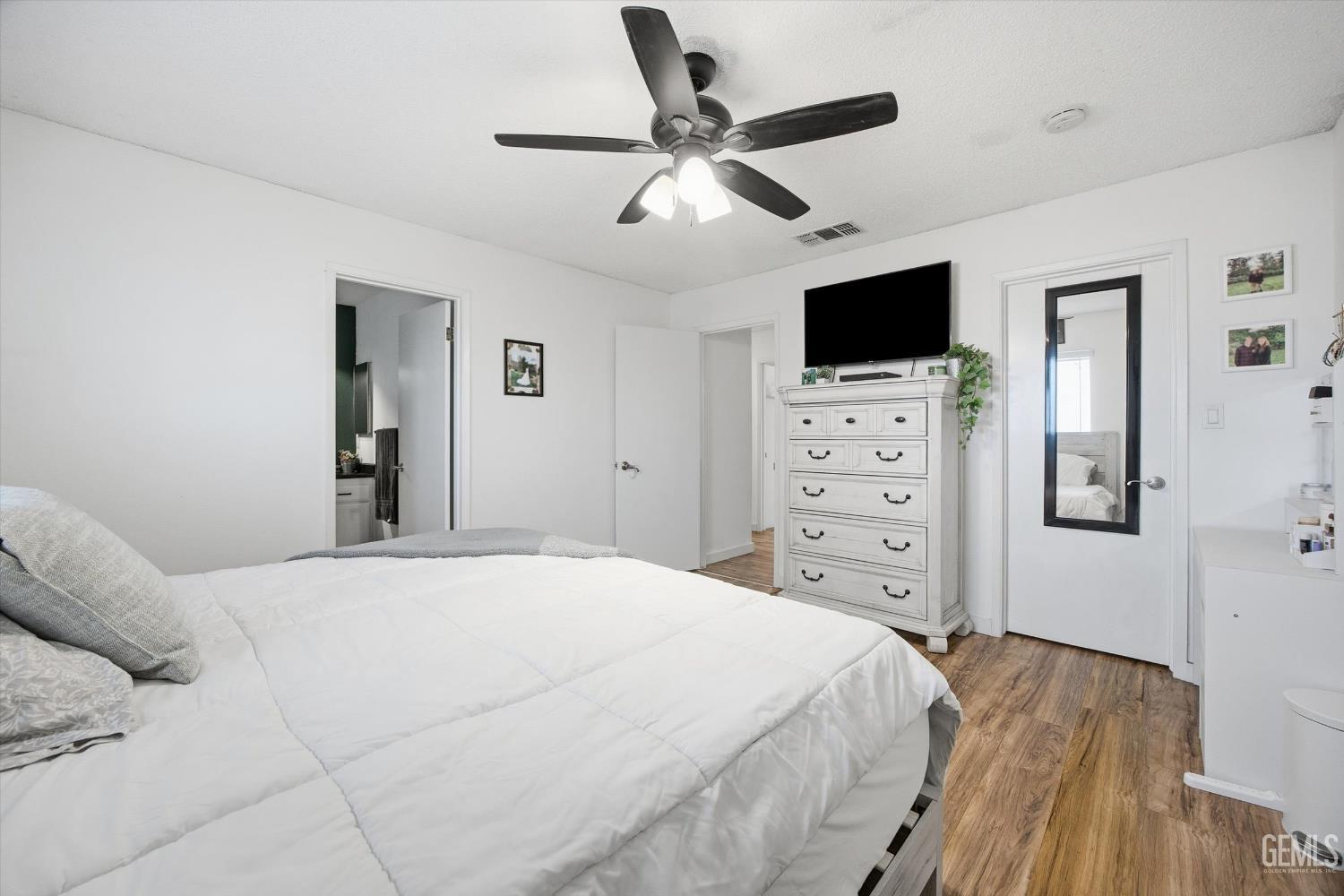 Undisclosed Address Tehachapi, CA 93561 - Photo 28 of 46 a bedroom with a bed a flat screen tv and a dresser