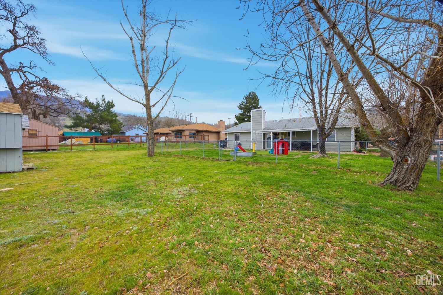 Undisclosed Address Tehachapi, CA 93561 - Photo 43 of 46 a view of a house with a big yard and large trees