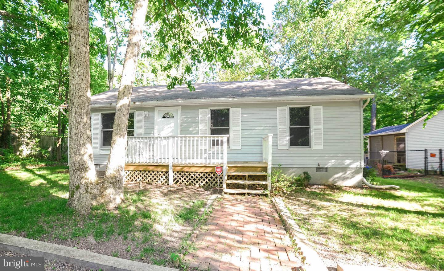 12788 Rio Grande Trail Lusby, MD 20657 - Photo 2 of 29 a view of a house with a yard