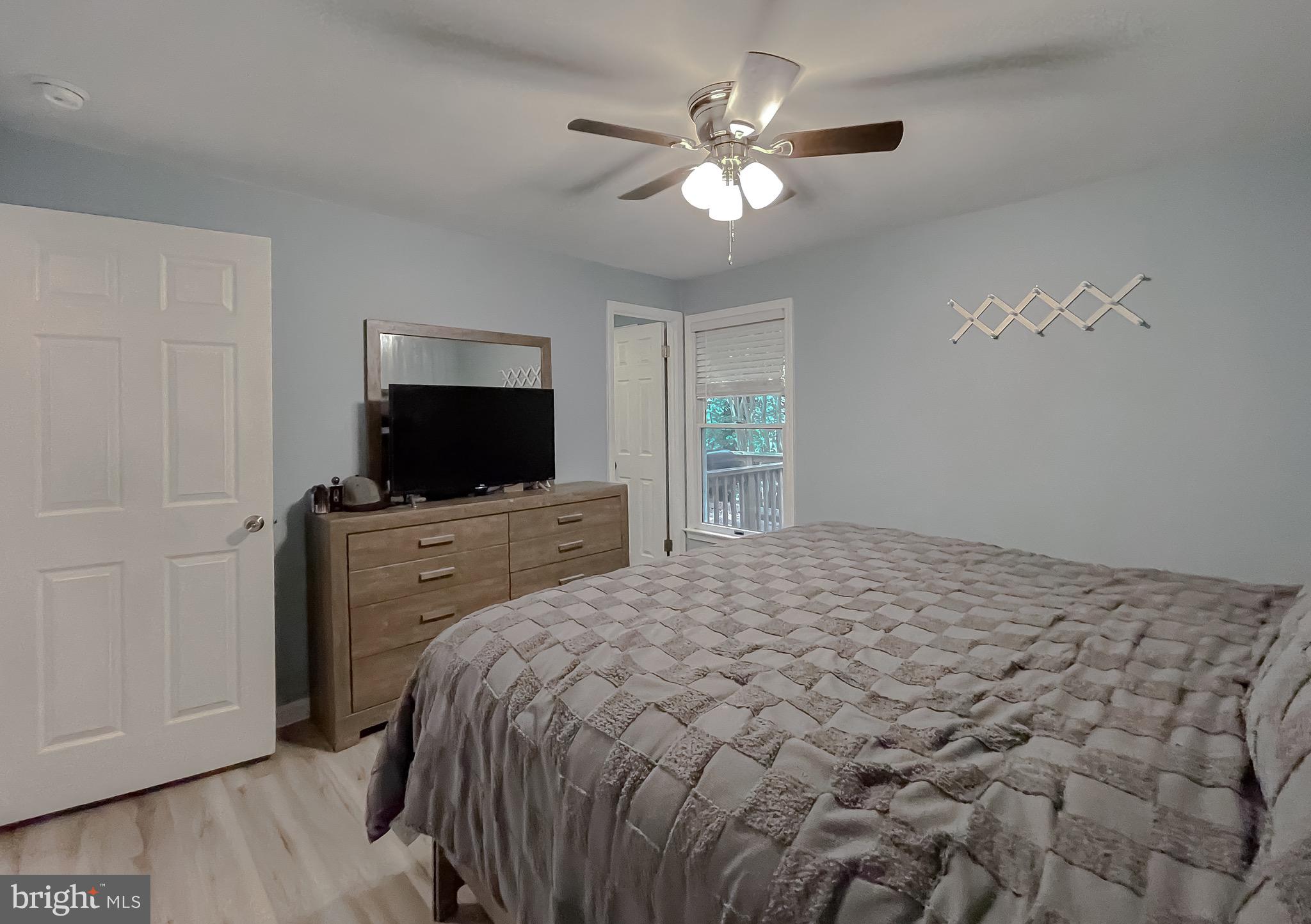 12788 Rio Grande Trail Lusby, MD 20657 - Photo 22 of 29 a bedroom with a bed and a flat screen tv