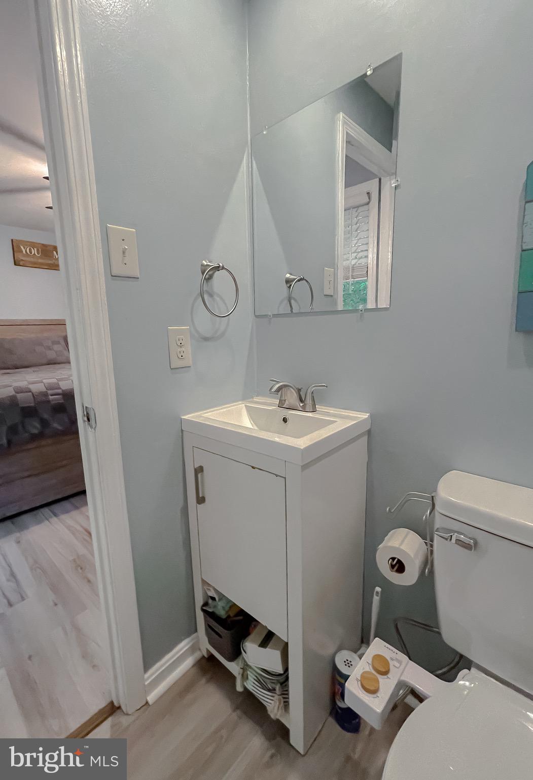 12788 Rio Grande Trail Lusby, MD 20657 - Photo 24 of 29 a bathroom with a sink toilet and vanity