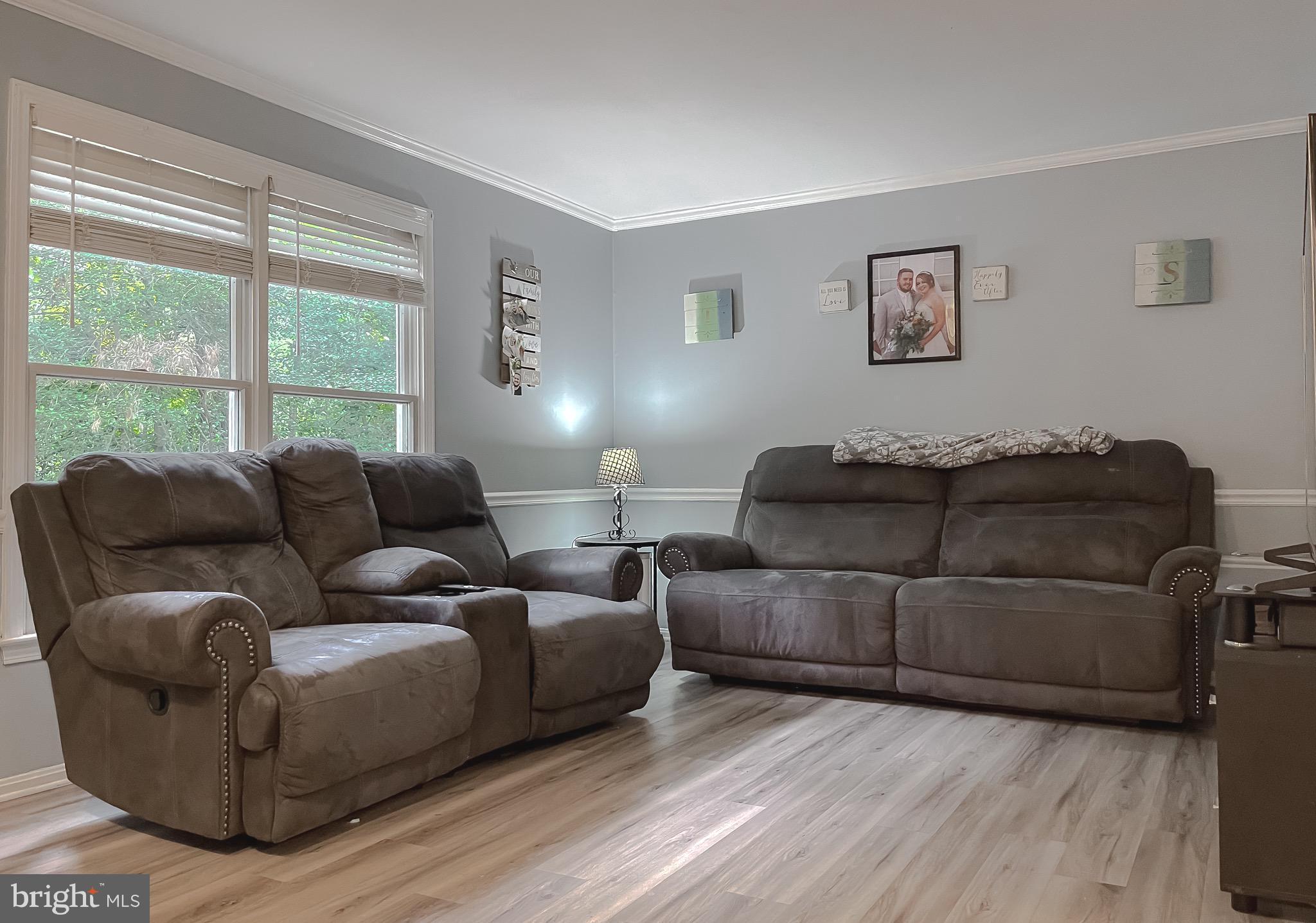 12788 Rio Grande Trail Lusby, MD 20657 - Photo 7 of 29 a living room with furniture and a large window