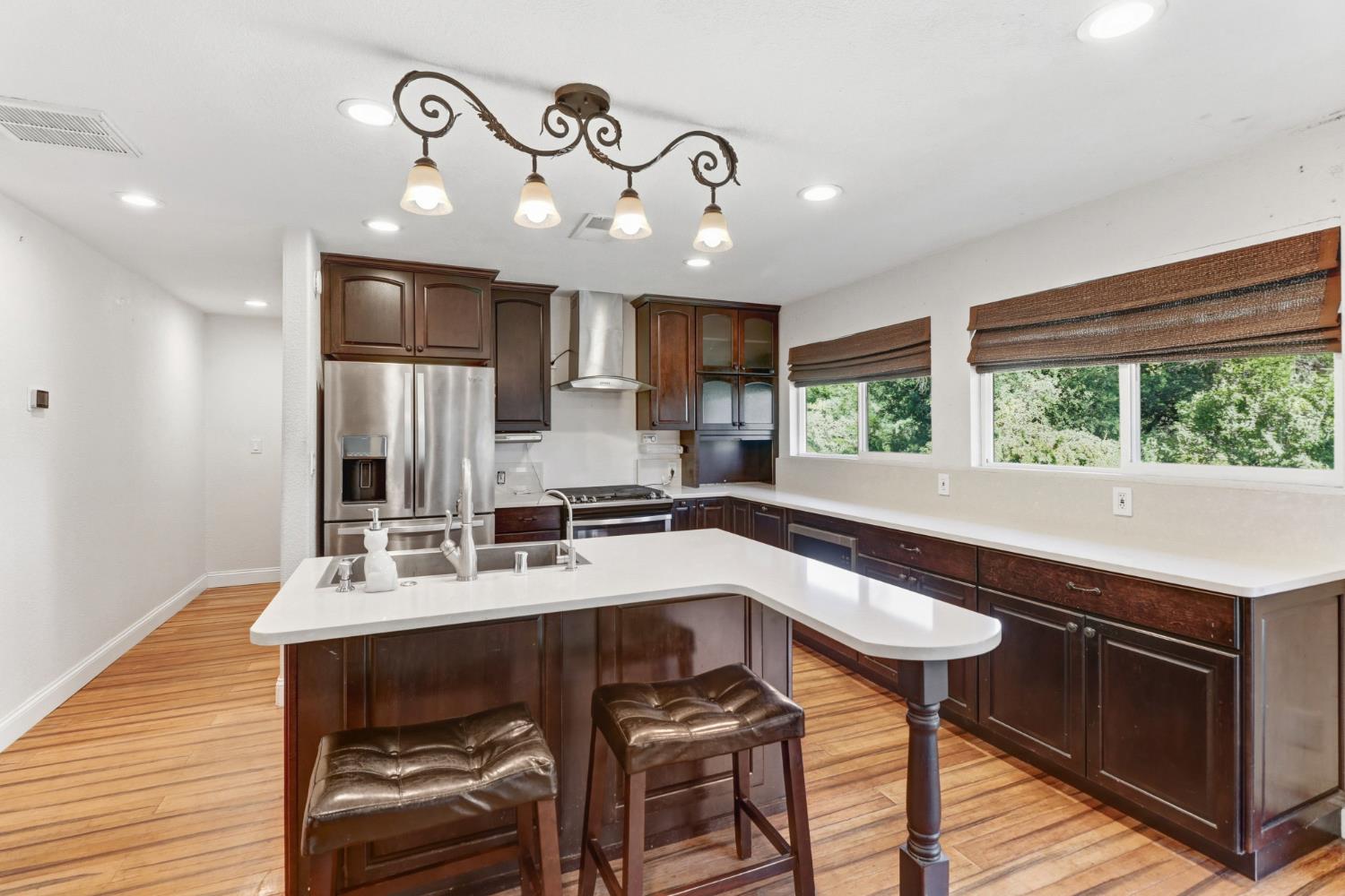 4330 Cavitt Stallman Road Granite Bay, CA 95746 - Photo 21 of 85 a kitchen with a table chairs sink and cabinets