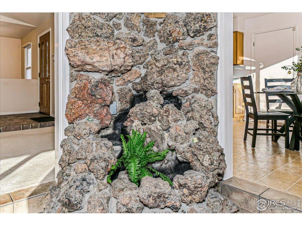 1725 Ridgewood Road Fort Collins, CO 80526 - Photo 15 of 46 Rock wall is also a functioning water feature. Bring the outdoors in!