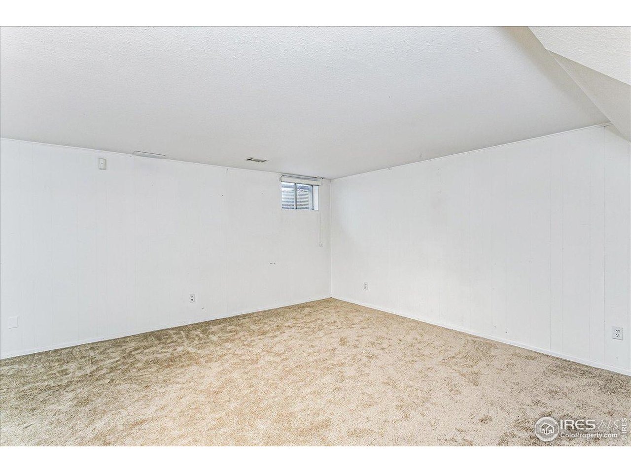 1725 Ridgewood Road Fort Collins, CO 80526 - Photo 21 of 46 Basement rec room with new carpet