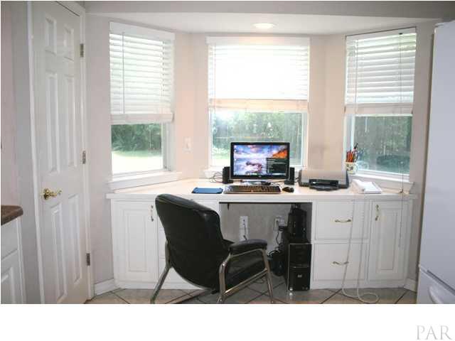 3925 Croydon Road Pensacola, FL 32514 - Photo 7 of 20 Bay window with built in desk & cabinets plus pantry