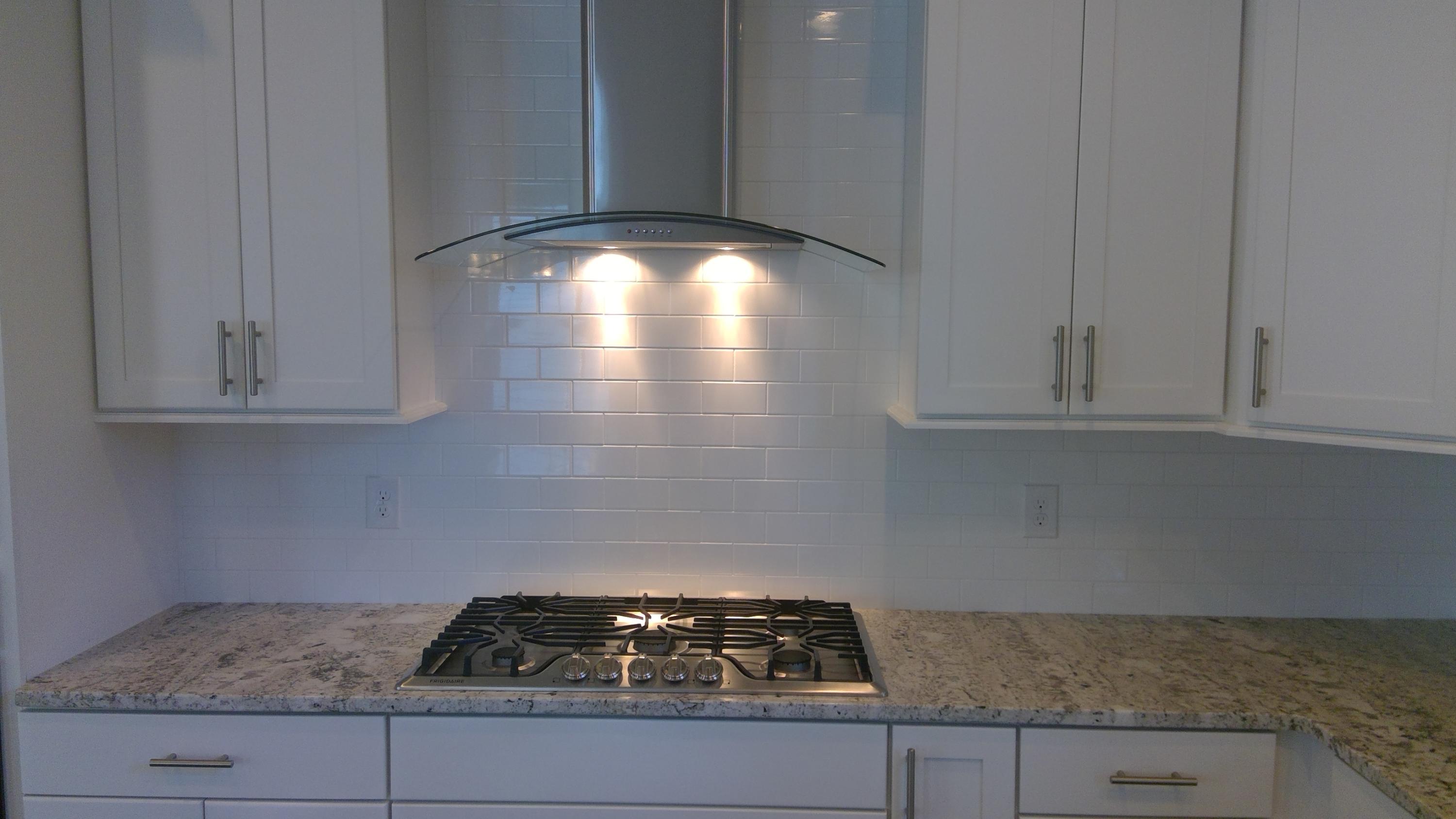 310 Grande Pointe Circle Inlet Beach, FL 32461 - Photo 13 of 63 a kitchen with granite countertop a stove and cabinets