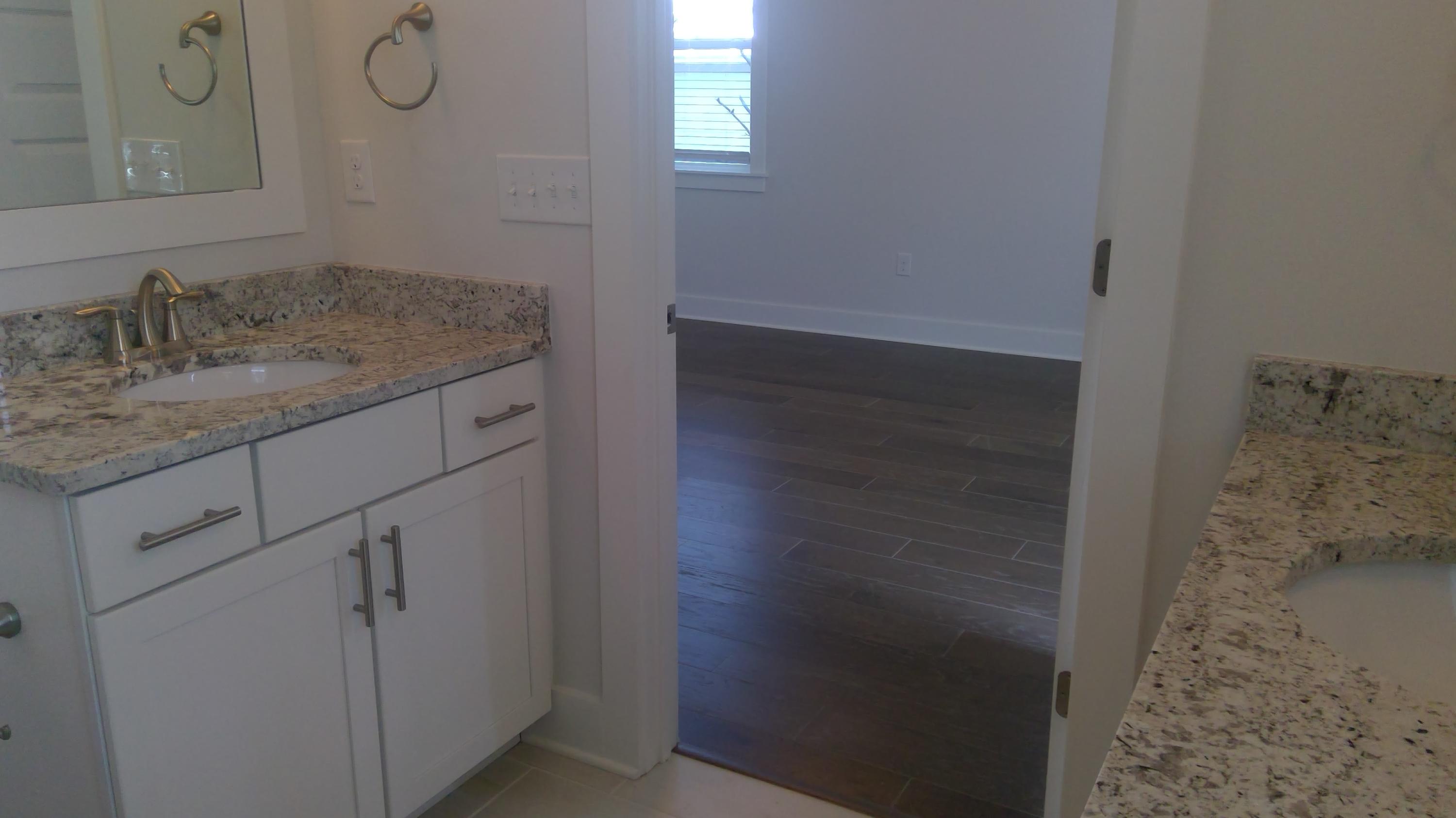 310 Grande Pointe Circle Inlet Beach, FL 32461 - Photo 33 of 63 a bathroom with a granite countertop sink and a mirror