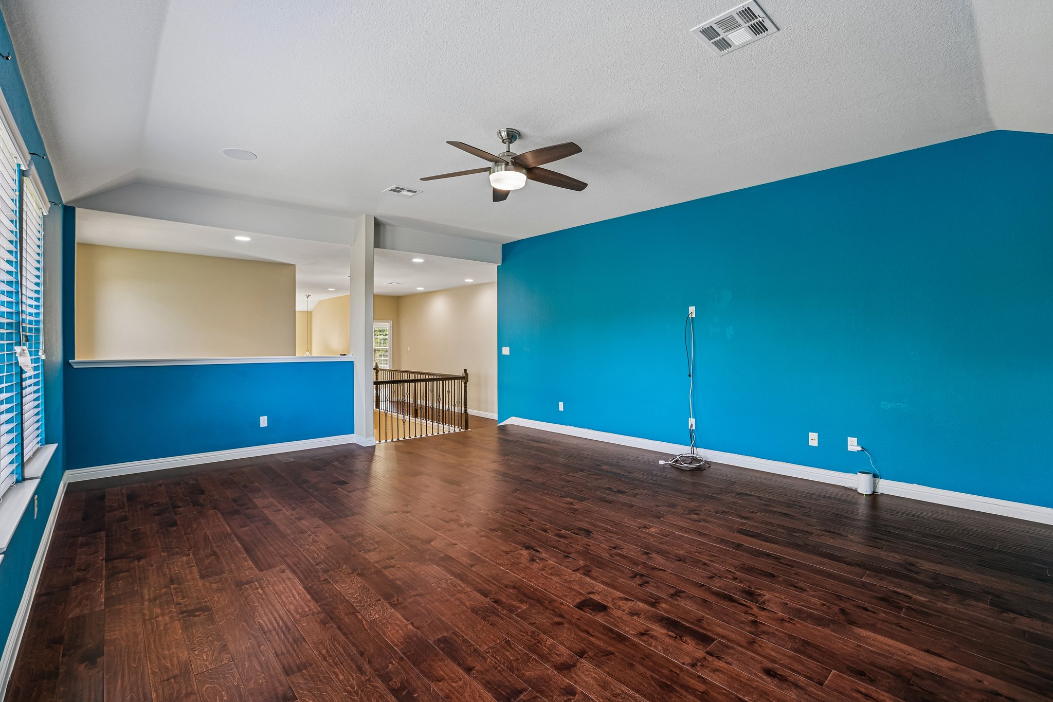 1924 Granite Springs Road Leander, TX 78641 - Photo 23 of 36 Rich hardwood flooring extends through this generous living space, accented by a bright ceiling fan and abundant natural light.