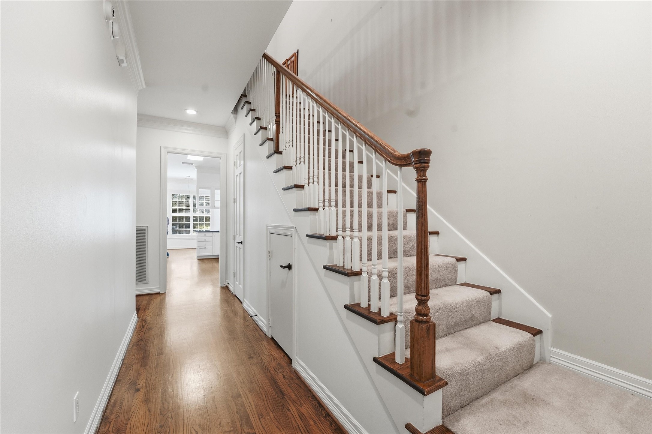 3210 Maroneal Street Houston, TX 77025 - Photo 17 of 28 a view of entryway and hall with wooden floor