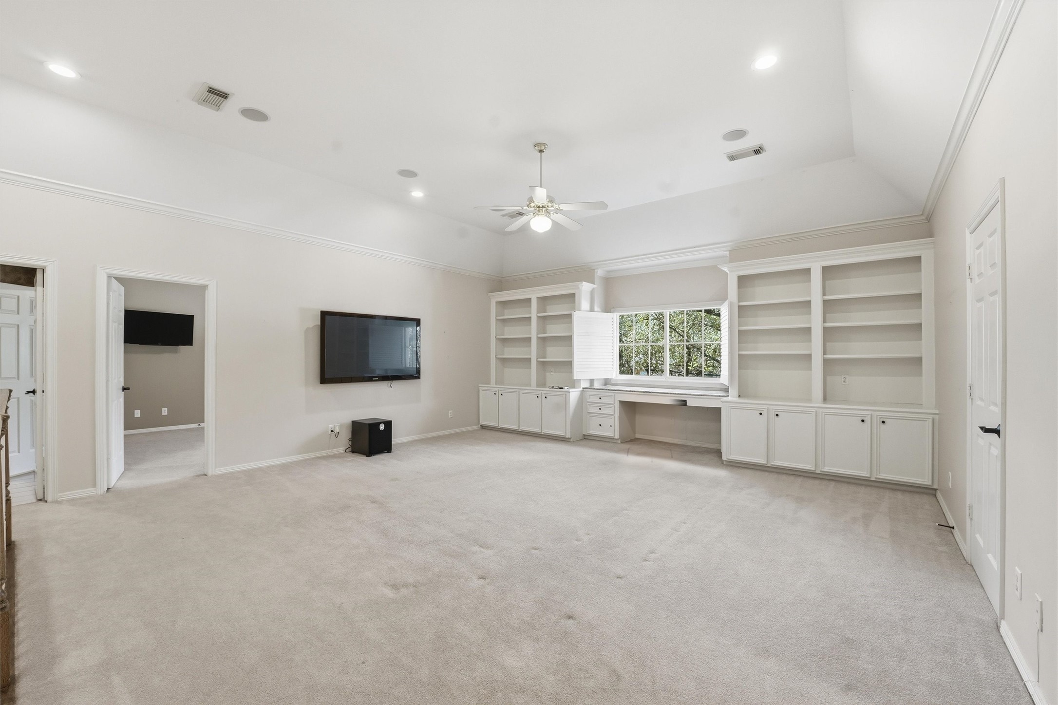 3210 Maroneal Street Houston, TX 77025 - Photo 18 of 28 a view of an empty room with a window and a kitchen