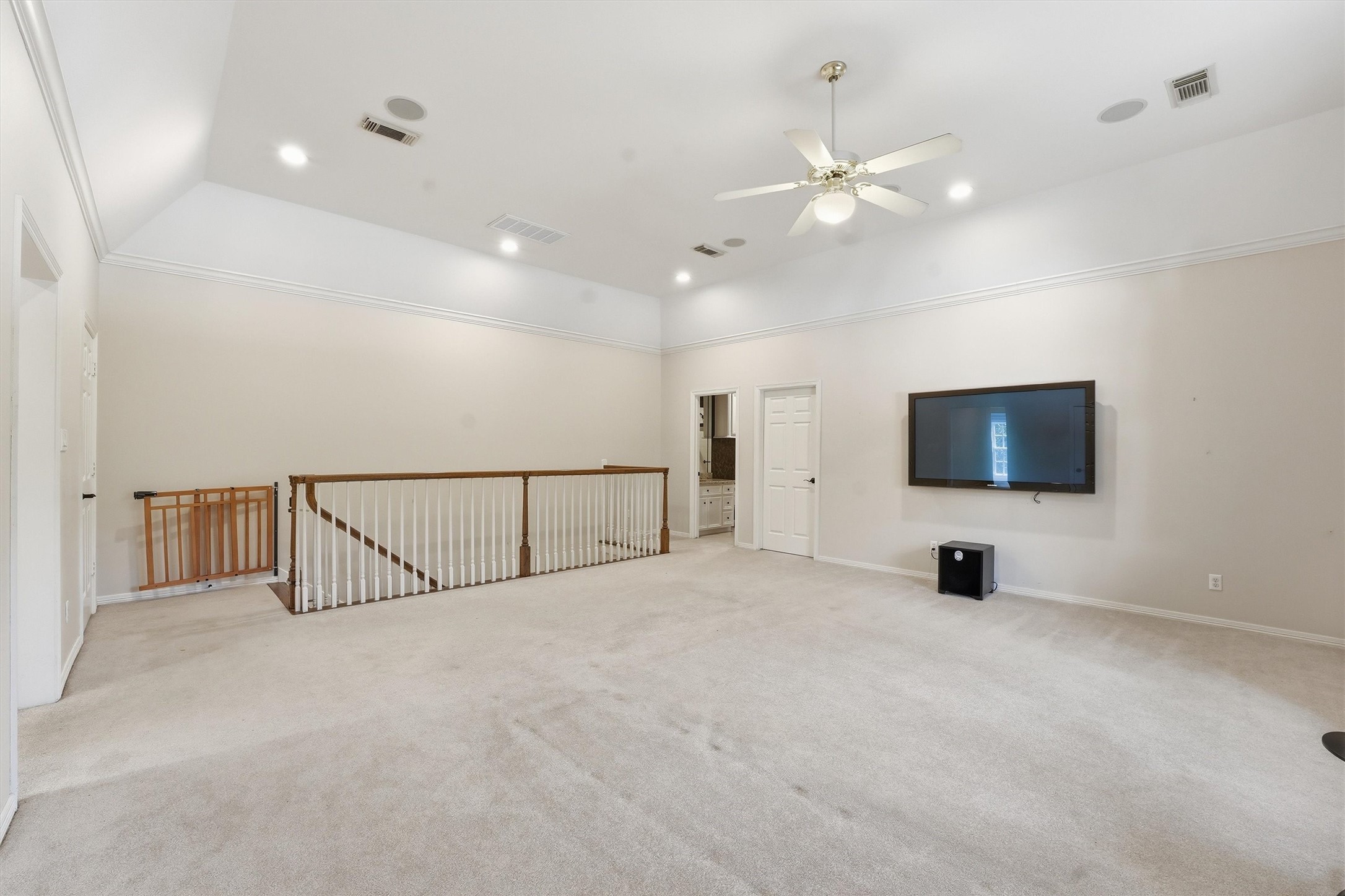 3210 Maroneal Street Houston, TX 77025 - Photo 19 of 28 a view of an empty room with a tv