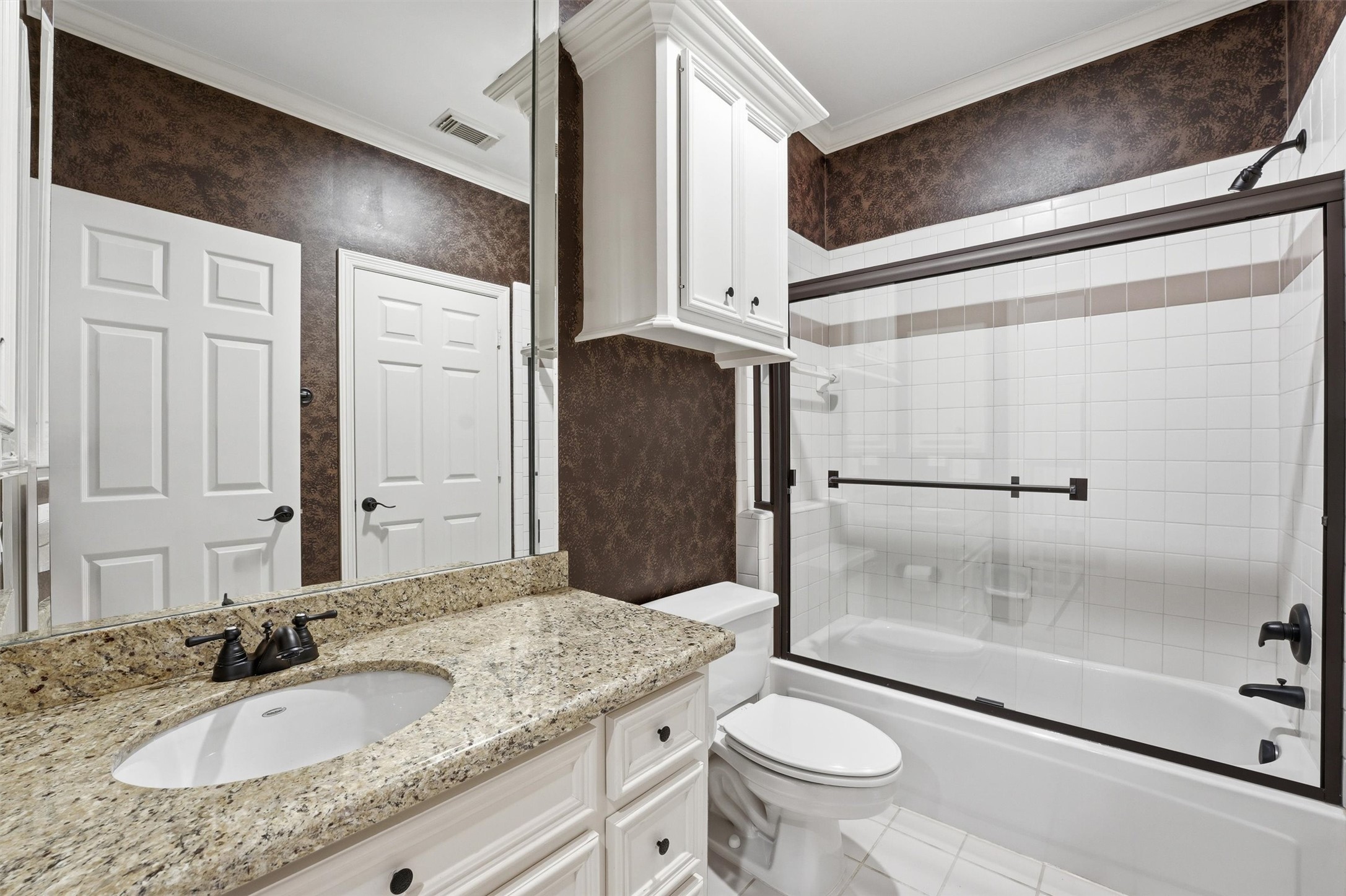 3210 Maroneal Street Houston, TX 77025 - Photo 21 of 28 a bathroom with a granite countertop sink toilet and shower
