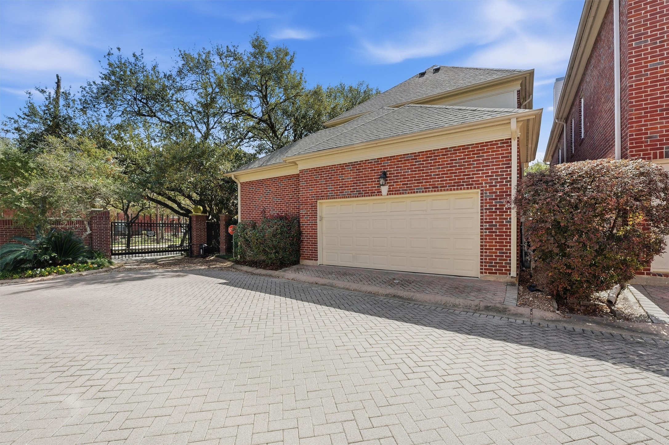 3210 Maroneal Street Houston, TX 77025 - Photo 26 of 28 a front view of a house with a yard and garage