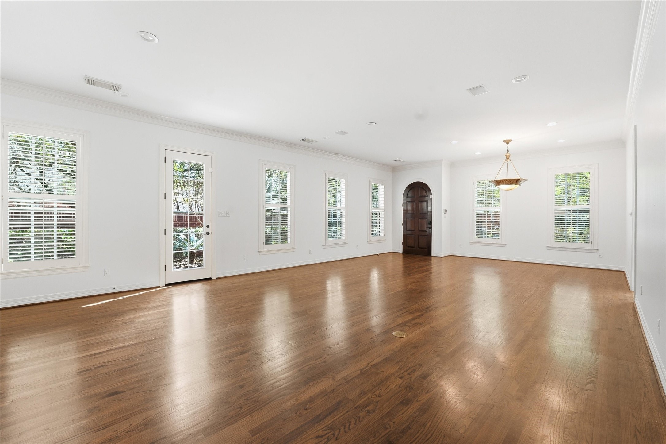 3210 Maroneal Street Houston, TX 77025 - Photo 5 of 28 a view of empty room with wooden floor and fan