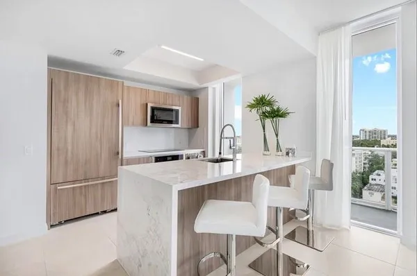 a bedroom with a bed and a view of bathroom