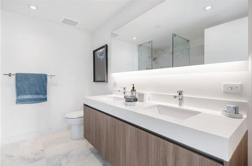 401 North Birch Road, Unit 515 Fort Lauderdale, FL 33304 - Photo 20 of 23 a bathroom with a sink double vanity and a toilet