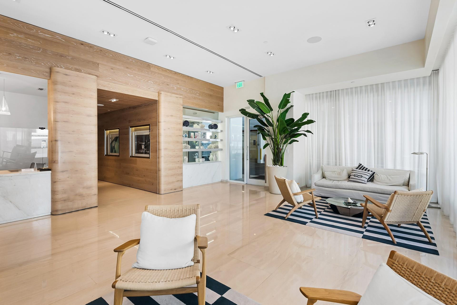 401 North Birch Road, Unit 515 Fort Lauderdale, FL 33304 - Photo 2 of 23 a living room with furniture flowerpot and wooden floor
