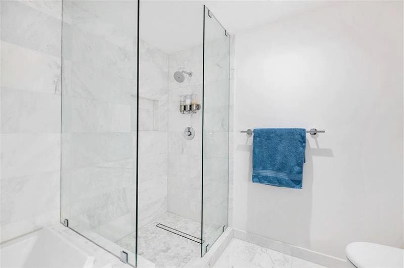 401 North Birch Road, Unit 515 Fort Lauderdale, FL 33304 - Photo 22 of 23 a bathroom with a shower and toilet