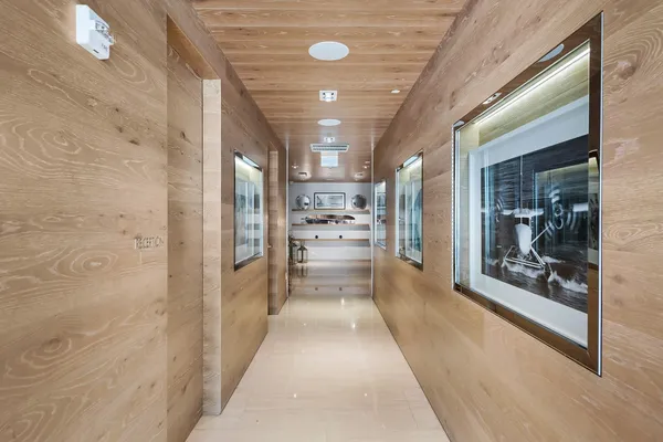 a view of a hallway with a view of the bathroom