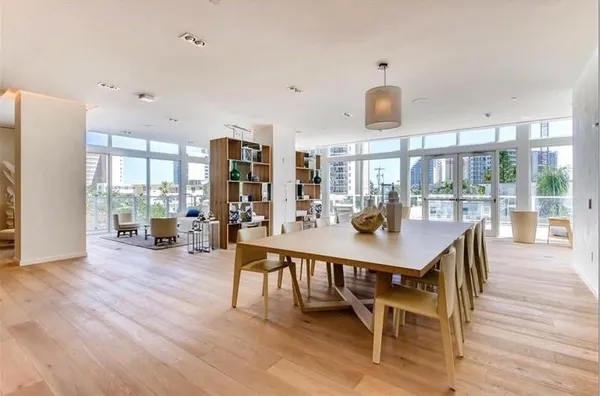a view of a dining room with furniture window and wooden floor