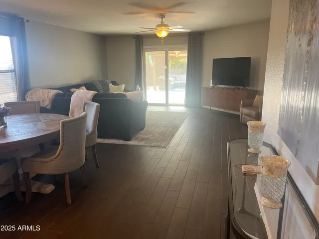 a view of a livingroom with furniture window and wooden floor