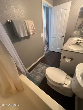 a bathroom with a toilet and a sink