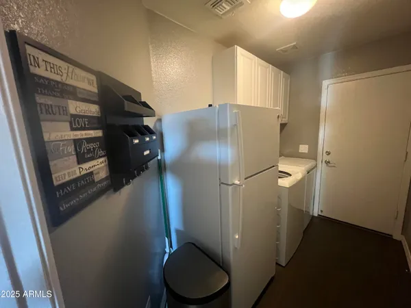 a bathroom with a granite countertop toilet and a shower