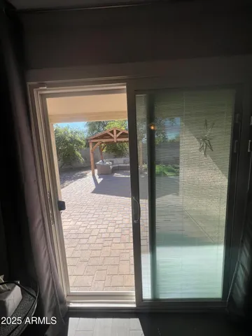 a view of a glass door with a glass door and a window